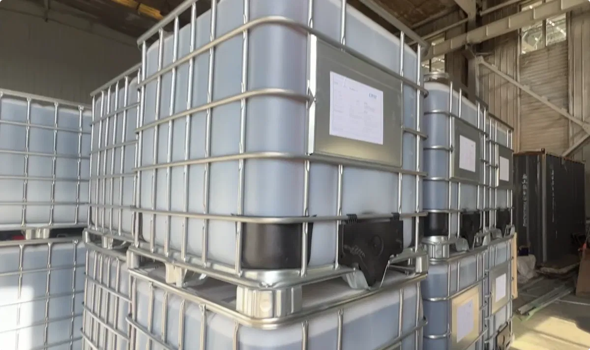 Close-up of DOTP plasticizer IBC tote showing Changxing label, batch number, and CAS 6422-86-2