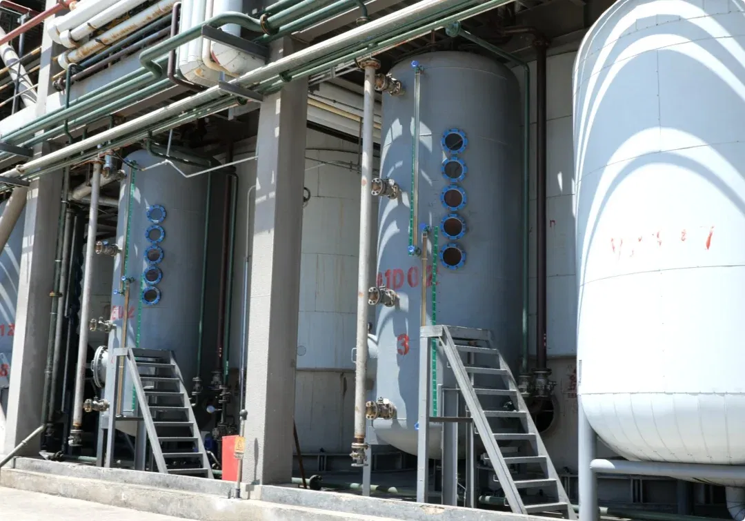 Transesterification reaction workshop with reaction vessels and storage tanks for DOTP production