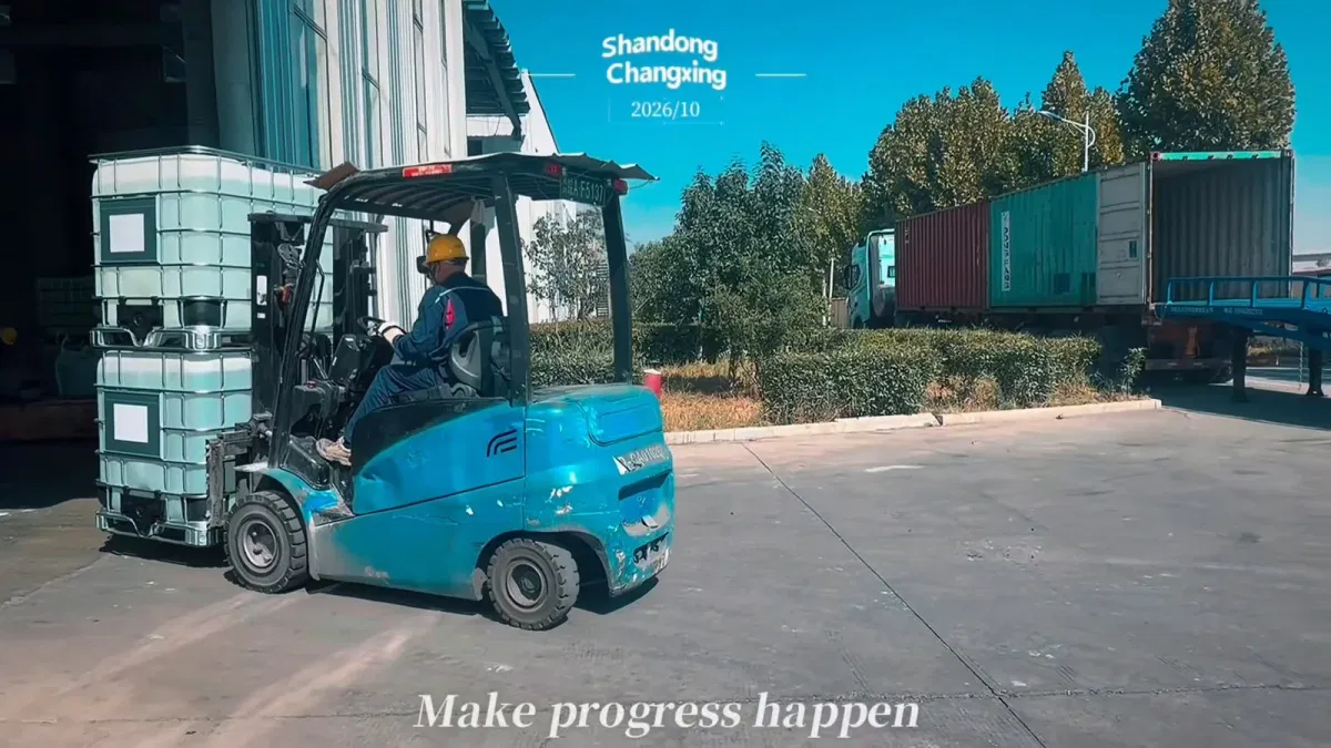 Forklift transporting two stacked 1000L IBC totes of ethylene glycol at Shandong Changxing warehouse yard