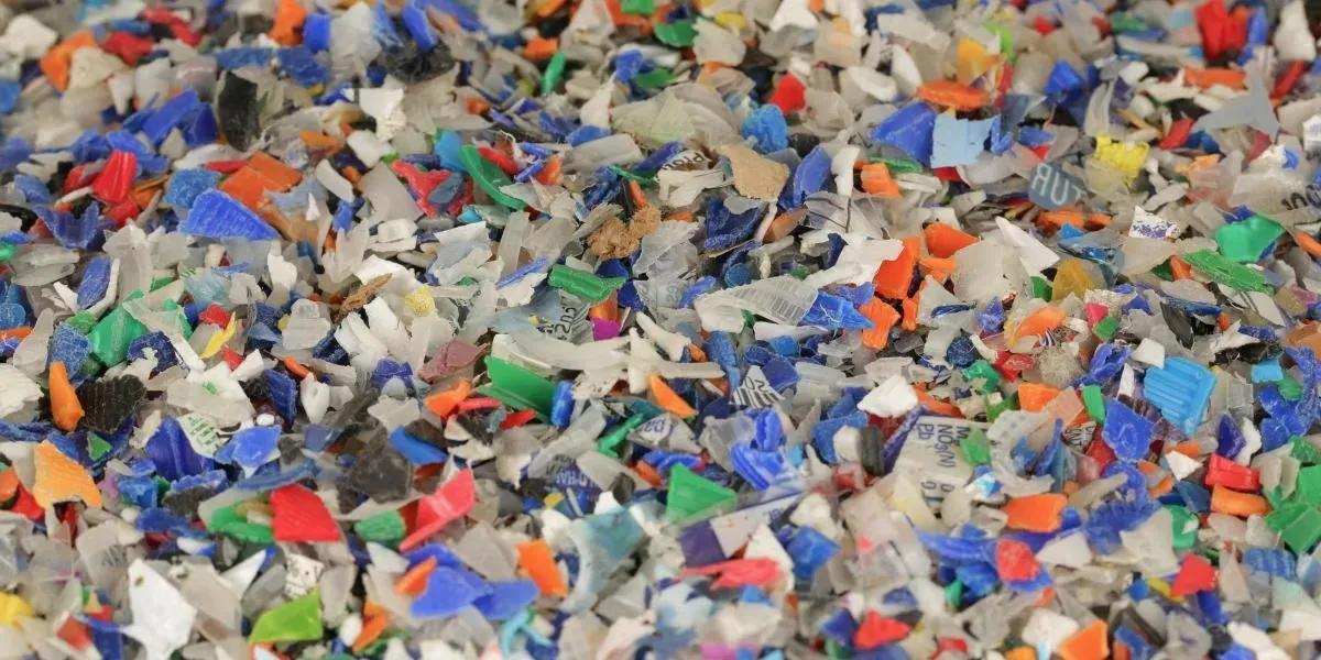 Colorful recycled PET plastic flakes ready for chemical recycling into DOTP
