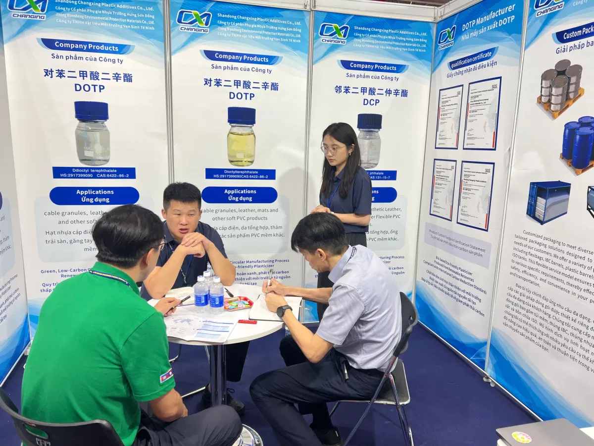 Changxing staff explaining DOTP, MEG and 2-octanol specifications to a visitor at Booth A138