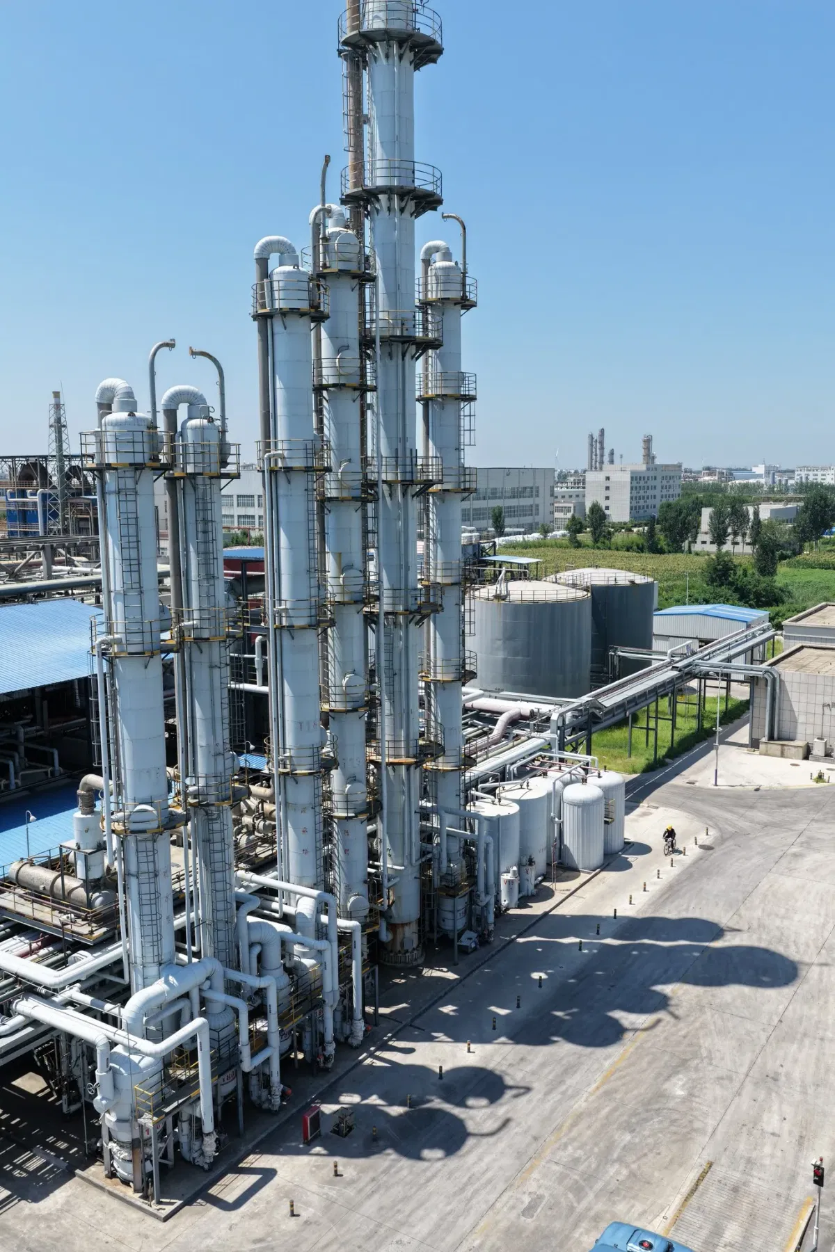 Distillation tower group at Wansheng DOTP factory for premium-grade plasticizer purification