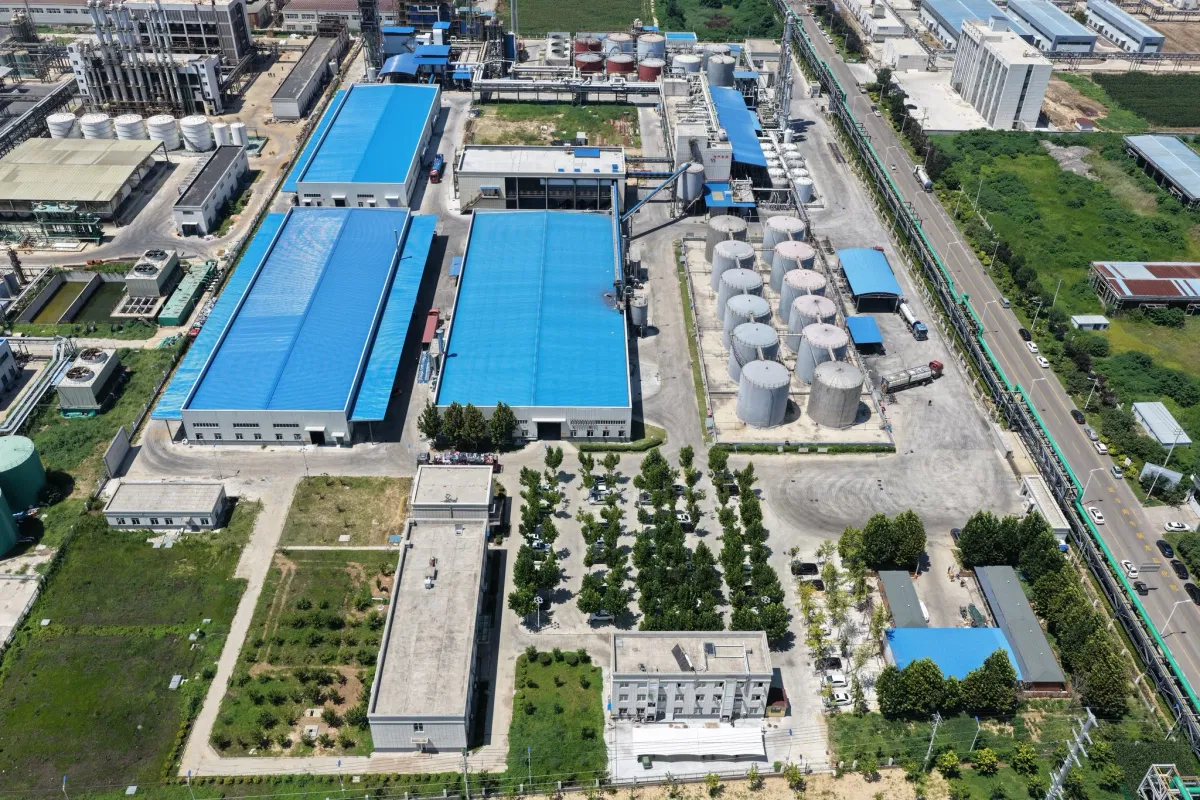 Aerial view from west to east of Jining Wansheng plasticizer factory showing R&D center, laboratory and office area