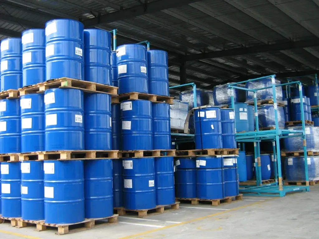 Warehouse interior with organized chemical barrel storage on pallets